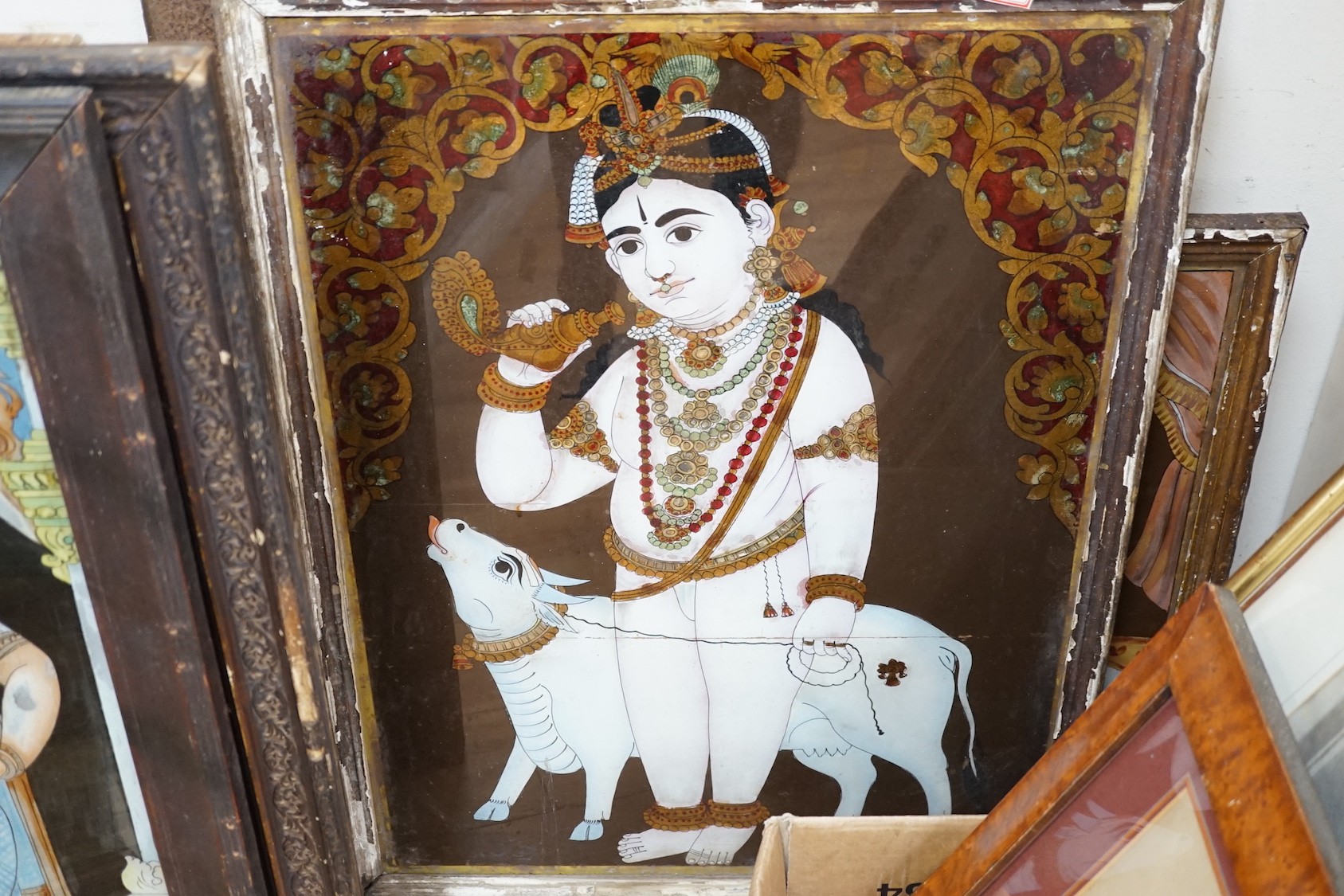 Indian School c.1900, eight reverse paintings on glass, Deities and noblemen, largest 61 x 44cm